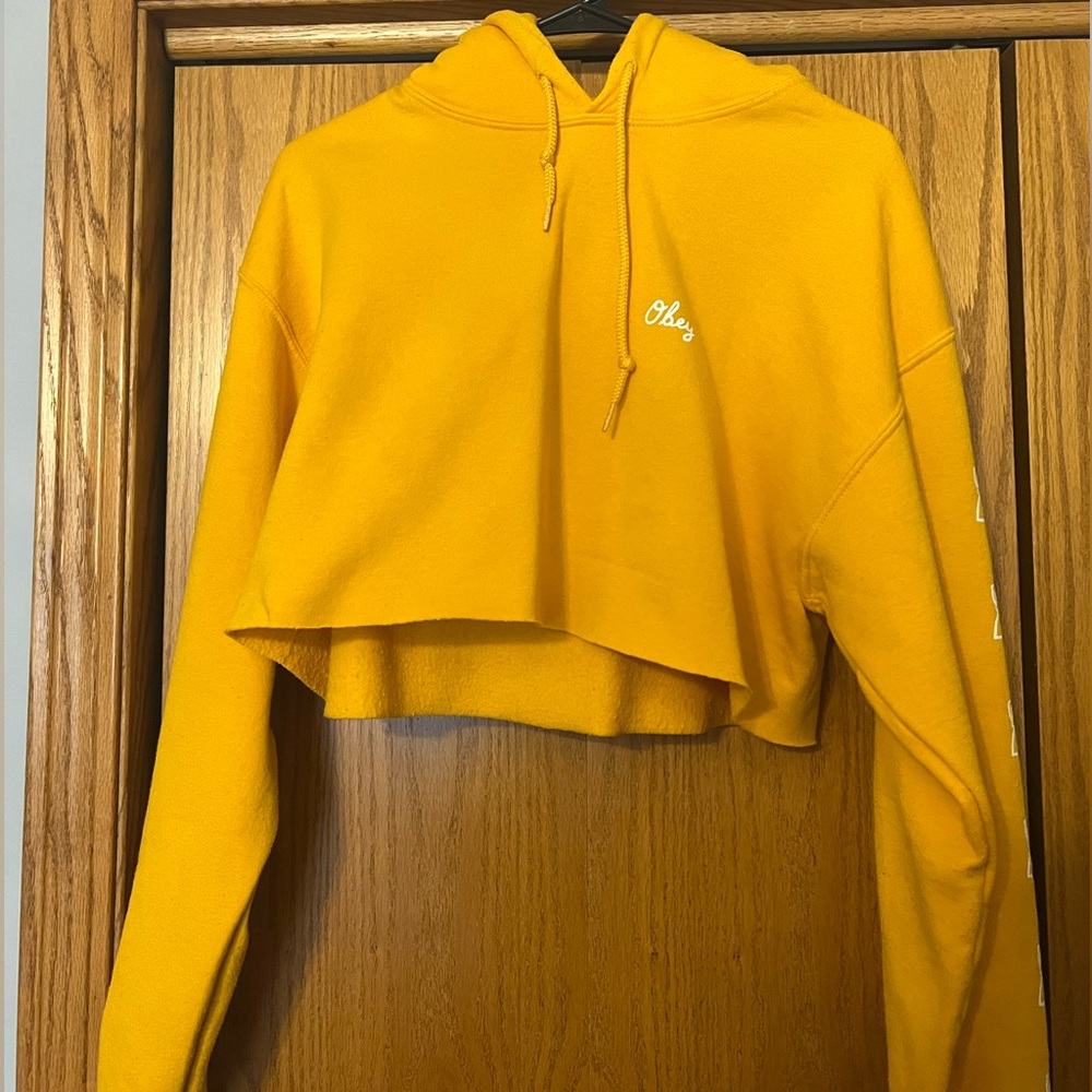 Brand: obey ; size: medium ; color: yellow/gold with white roses on sleeves